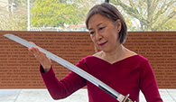 Woman holding a Samurai sword Woman holding a Samurai sword