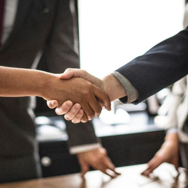 A man and woman shaking hands