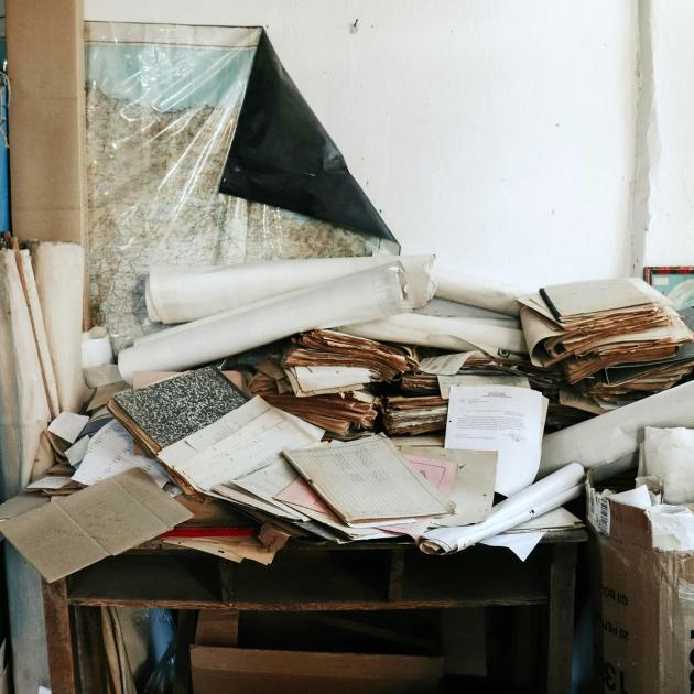 paper clutter on a desk